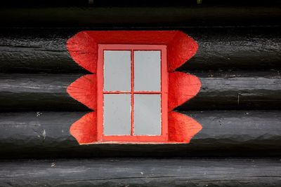 Close-up of red door with text