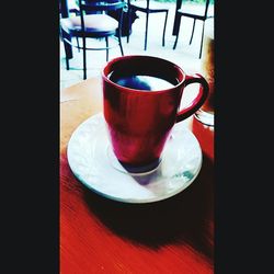 Close-up of coffee cup on table