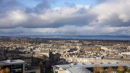 High angle view of townscape against cloudy sky