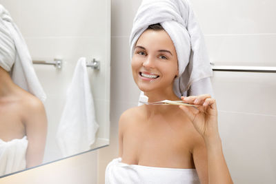 Portrait of young woman in bathroom