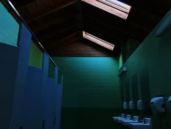 Low angle view of empty corridor in building