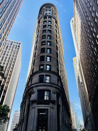 Low angle view of skyscrapers against sky