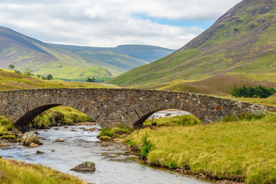 Scenic view of bridge over river against sky