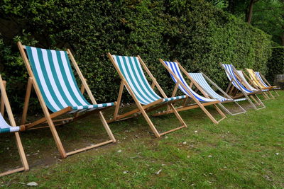 Empty chairs on field