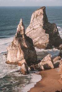 Rocks on shore against sea