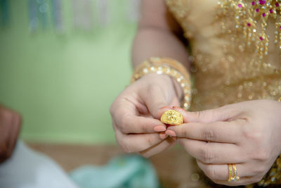 Close-up of woman holding hands