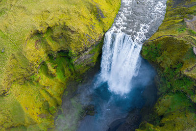 Skogafoss waterfall by drone, aerial view, iceland