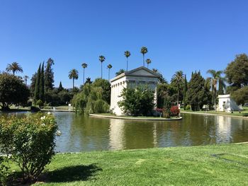 Scenic view of lake against clear blue sky