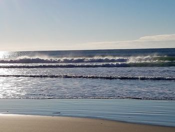 Scenic view of beach against clear sky