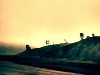 Scenic view of landscape at sunset