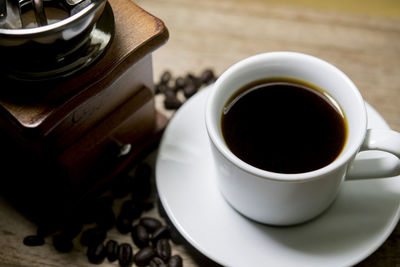 High angle view of coffee cup on table