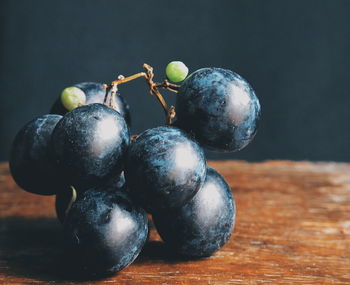 Close-up of grapes on table
