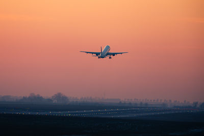 Airplane flying against sky