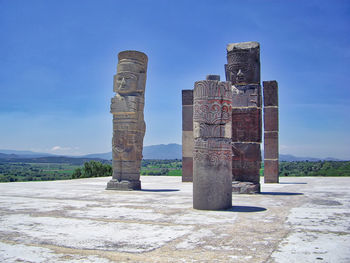 Old ruins of building against blue sky