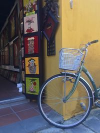 Bicycle parked against wall