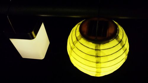 Close-up of lamp over black background