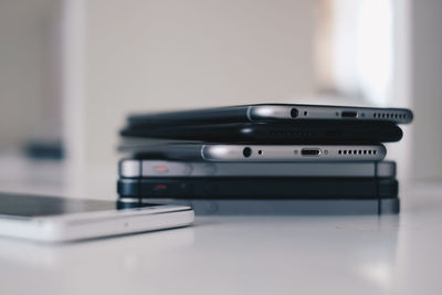 Close-up of smart phones on table