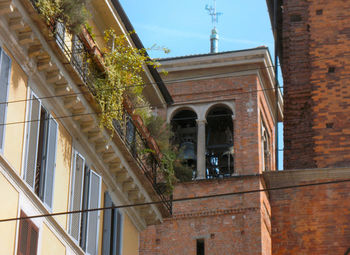 Low angle view of bell tower against sky