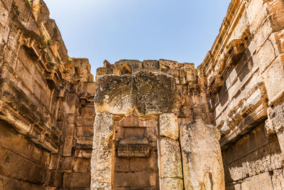 Low angle view of old temple against sky