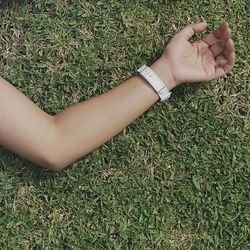 Woman standing on grassy field