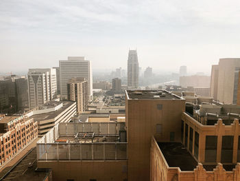 Buildings in city against sky