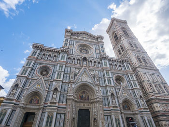 Low angle view of ornate building against sky