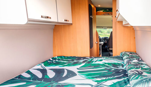 Interior of a camper van with bed