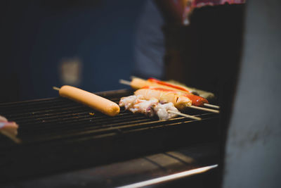 Close-up of meat on barbecue grill