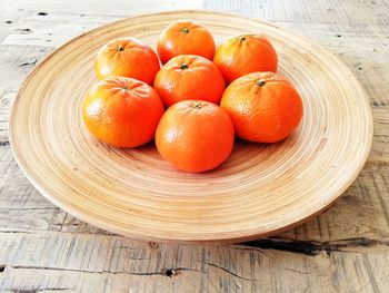 High angle view of orange fruits on table