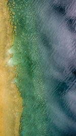 Aerial view of rocks by great lakes