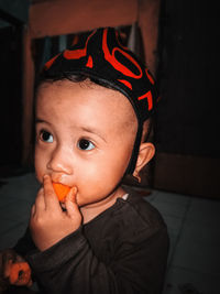 Close-up portrait of cute boy holding ice cream