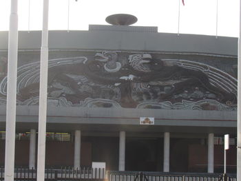 Low angle view of statue against building