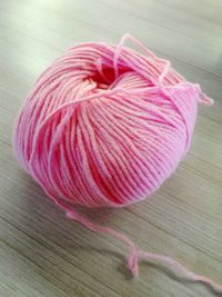 Close-up of pink fabric on table