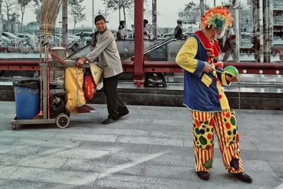 People walking on street in city