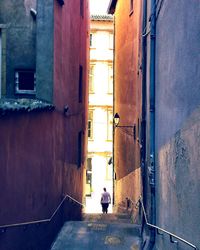 Full length of woman walking in tunnel