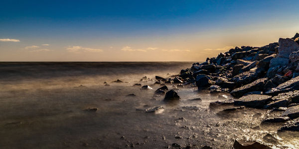 Scenic view of sea against sky during sunset