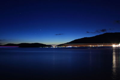 Scenic view of sea against sky at night