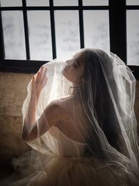 Rear view of bride with veil 