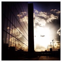 Low angle view of building against sky at sunset