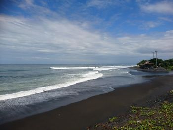 Scenic view of beach against sky