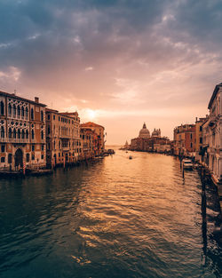 View of buildings in city at sunset