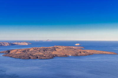 Scenic view of sea against blue sky