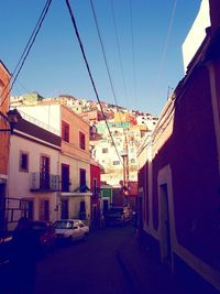 Houses in town against blue sky