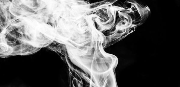 Close-up view of art over black background