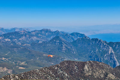 High angle view of mountain range against blue sky