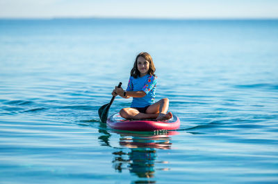 Full length of woman swimming in sea