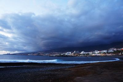 View of beach with city in background