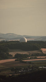 Scenic view of agricultural field against clear sky