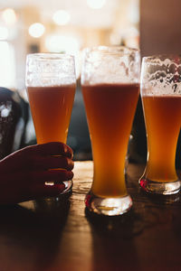 Close-up of beer glass on table
