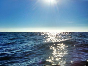 Scenic view of sea against clear sky at sunset